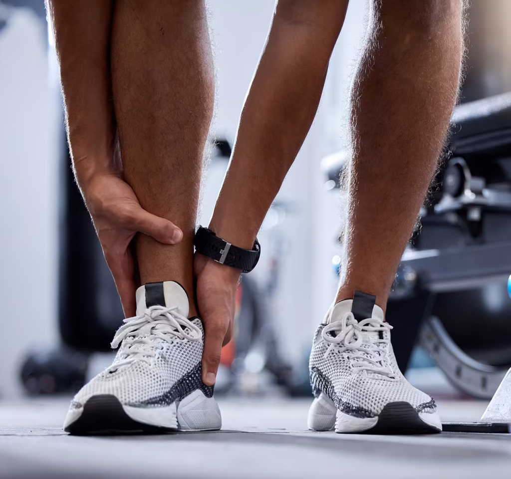 Foot & Ankle Clinic 1 man legs fitness and ankle injury in gym for trai 2025 04 05 22 58 00 utc e1760536701392