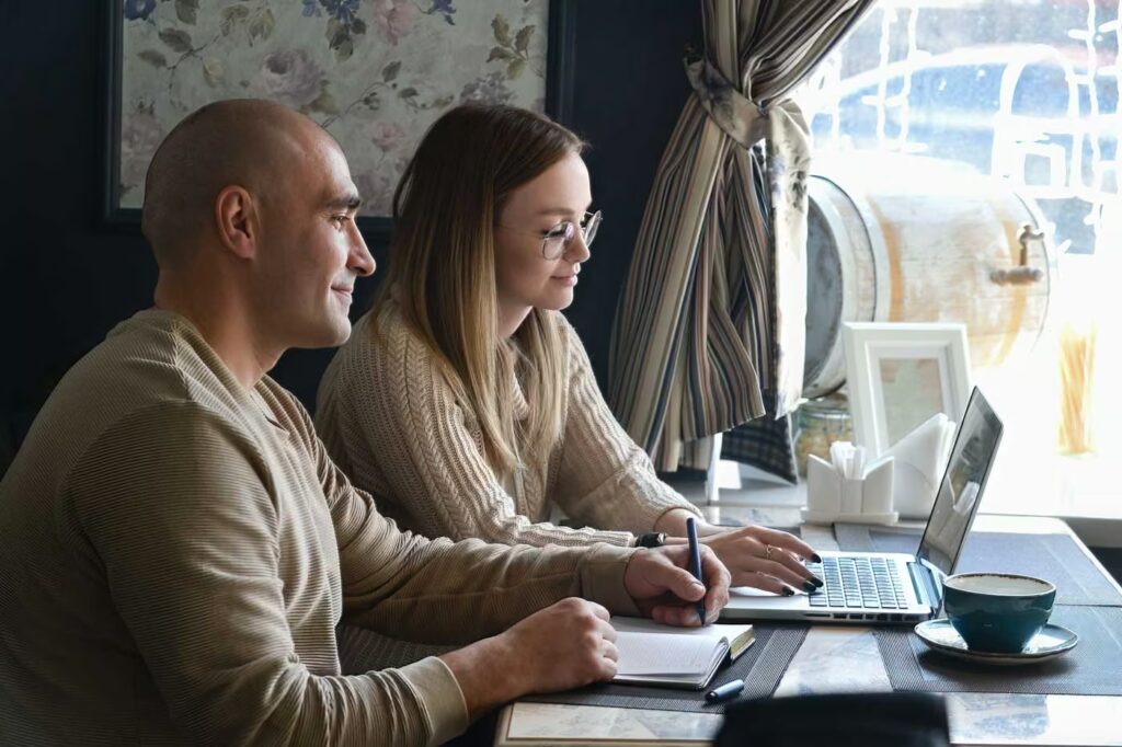 meeting of business partners at work in a cafe 2025 01 08 23 09 58 utc